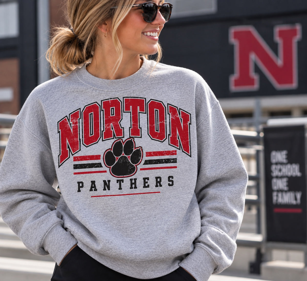 Norton Panthers Distressed Paw full-front design on a heather gray crewneck sweatshirt