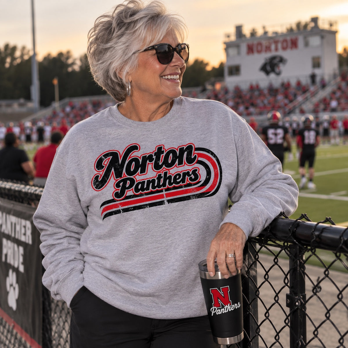 Norton Panthers retro script on a heather gray crewneck sweatshirt